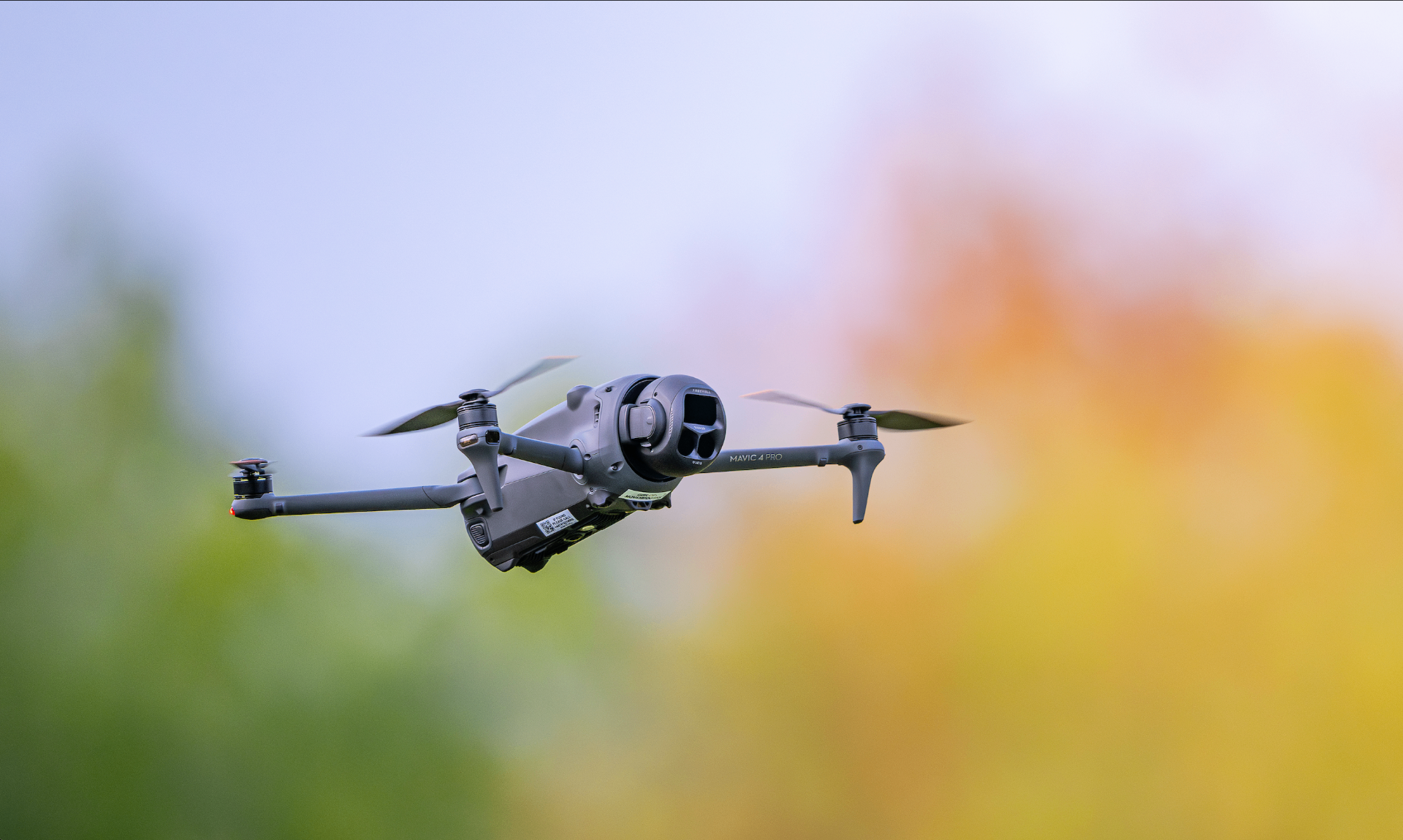Camera drone hovering at golden hour