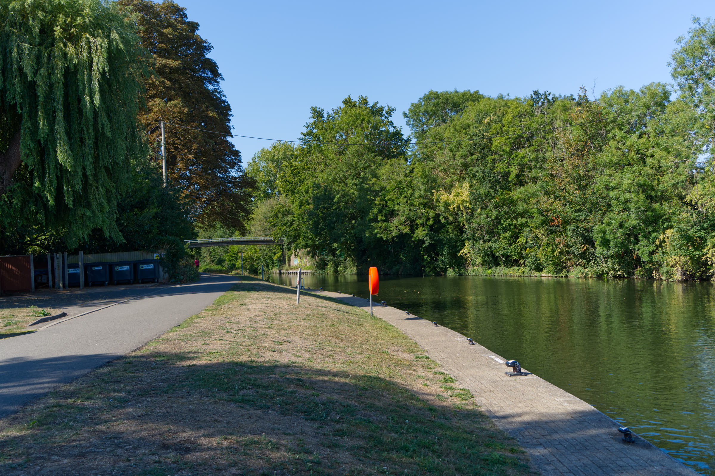 Empty moorings and towpath beside the river near the venue