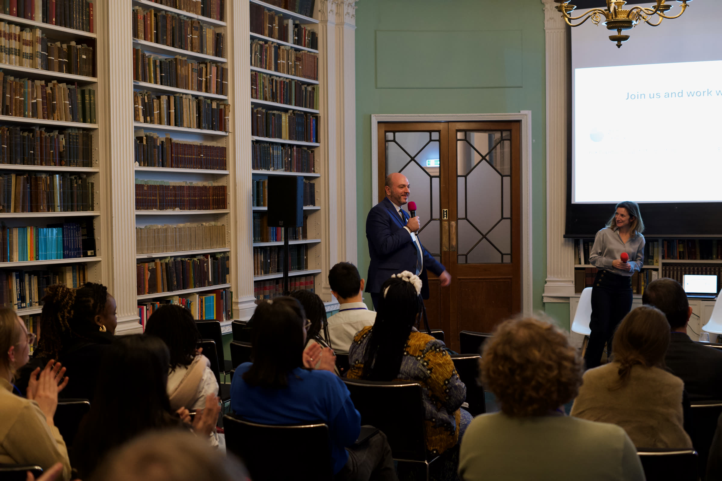 Speaker addressing delegates in the library session