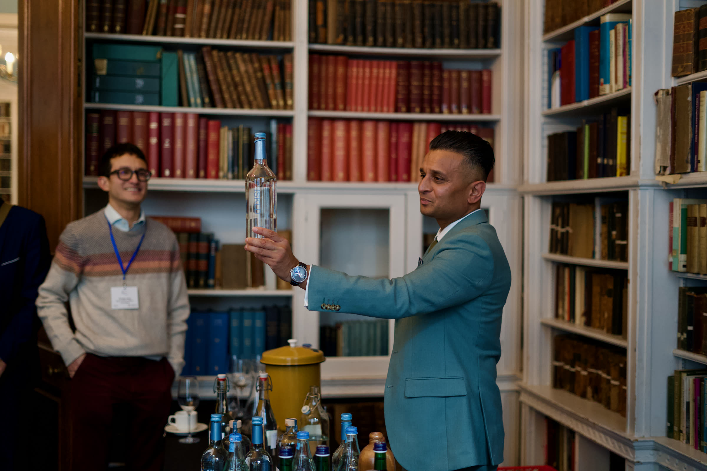 Water sommelier presenting a bottle during the tasting