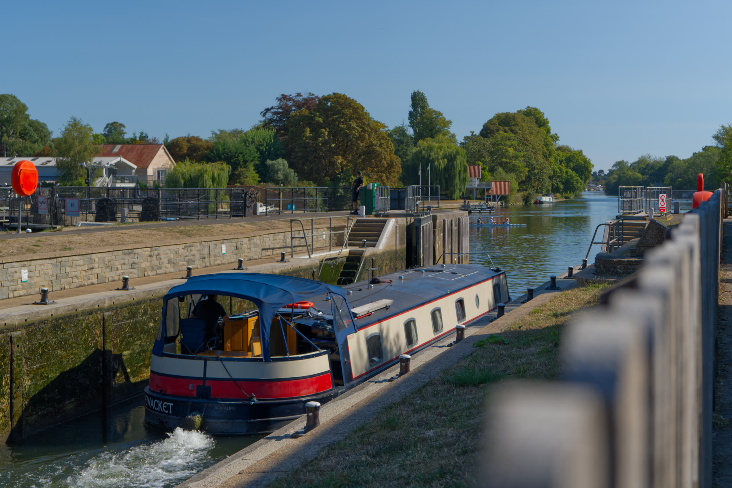 Narrowboat entering the lock beside the venue on the river