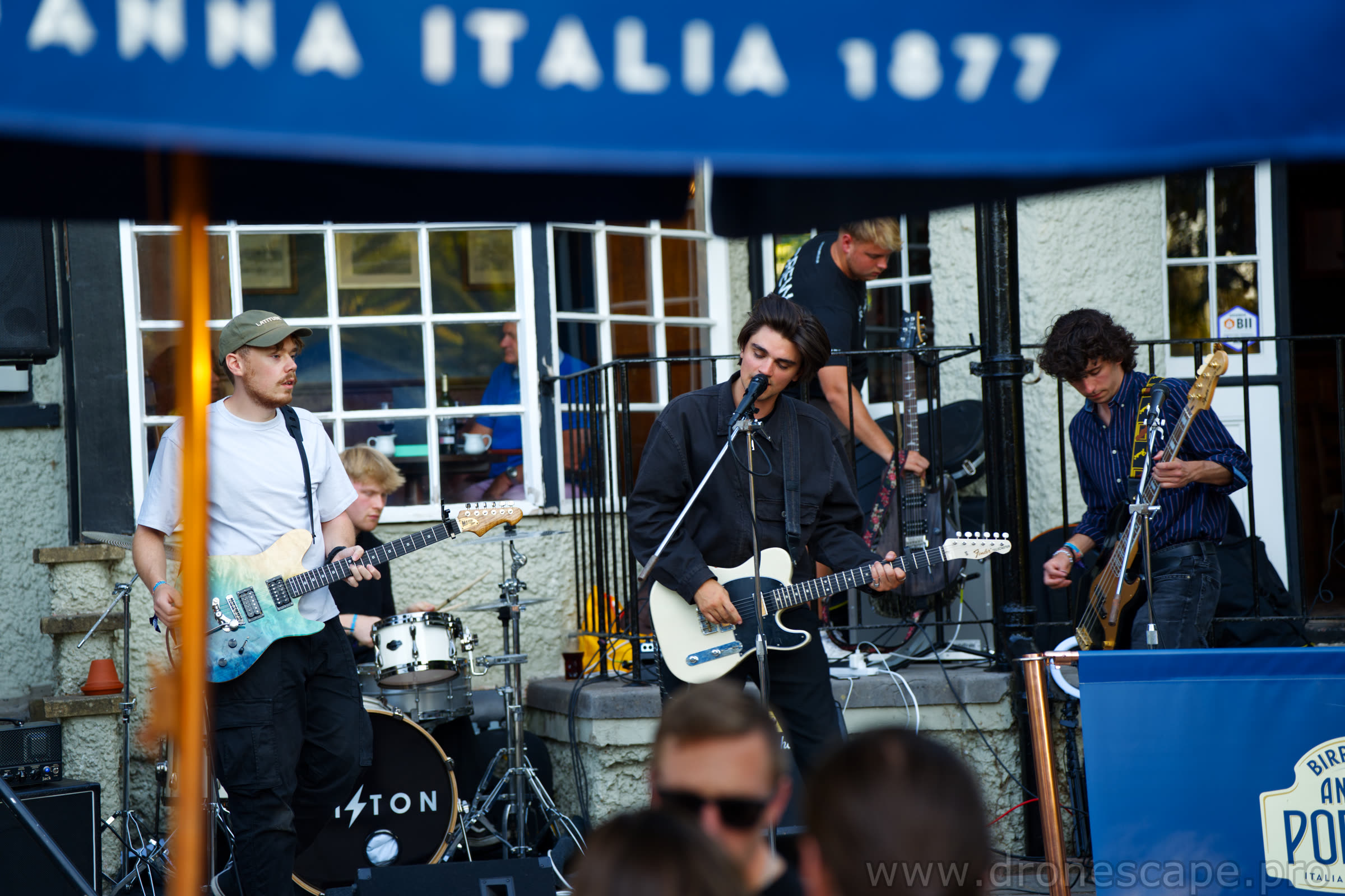 Wide view of the band performing on the terrace stage