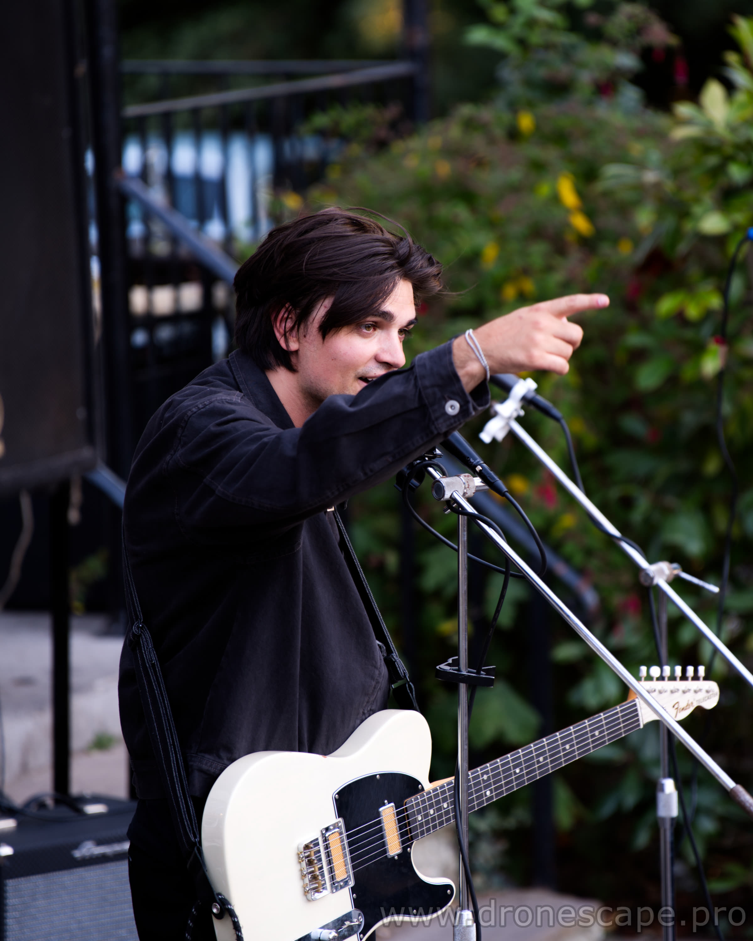 Singer pointing towards the crowd during the set