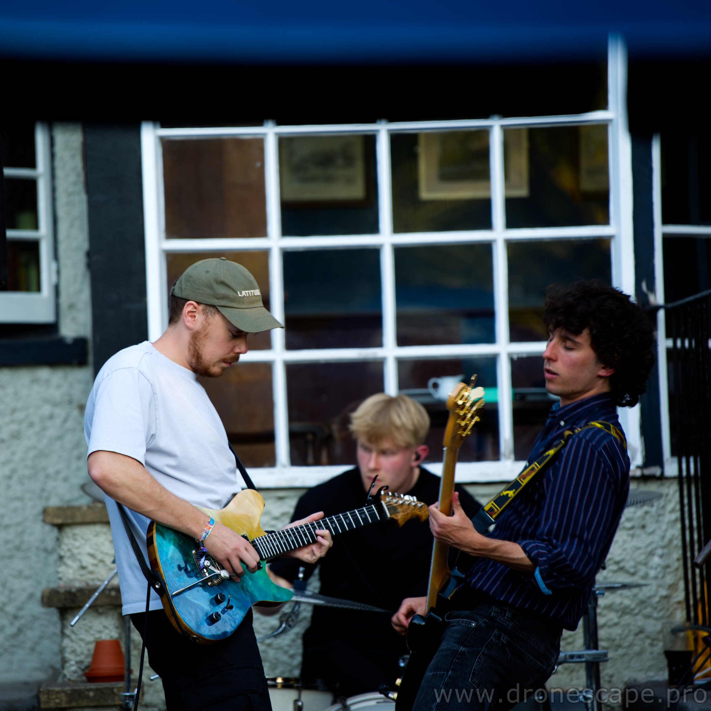 Guitarist, drummer and bassist during the live set