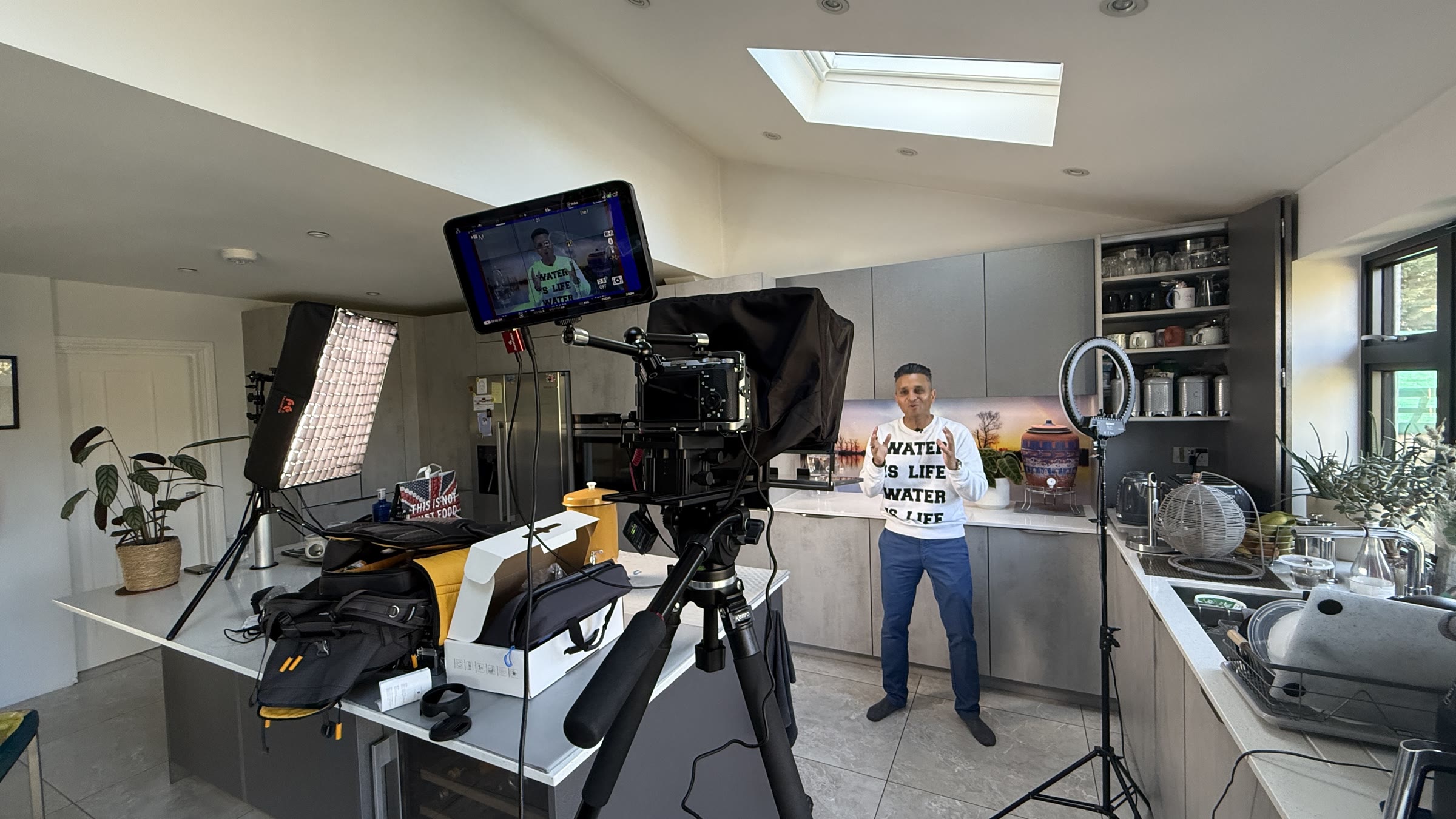 Wide behind-the-scenes view of the kitchen filming setup